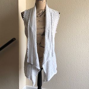 Sleeveless white cardigan